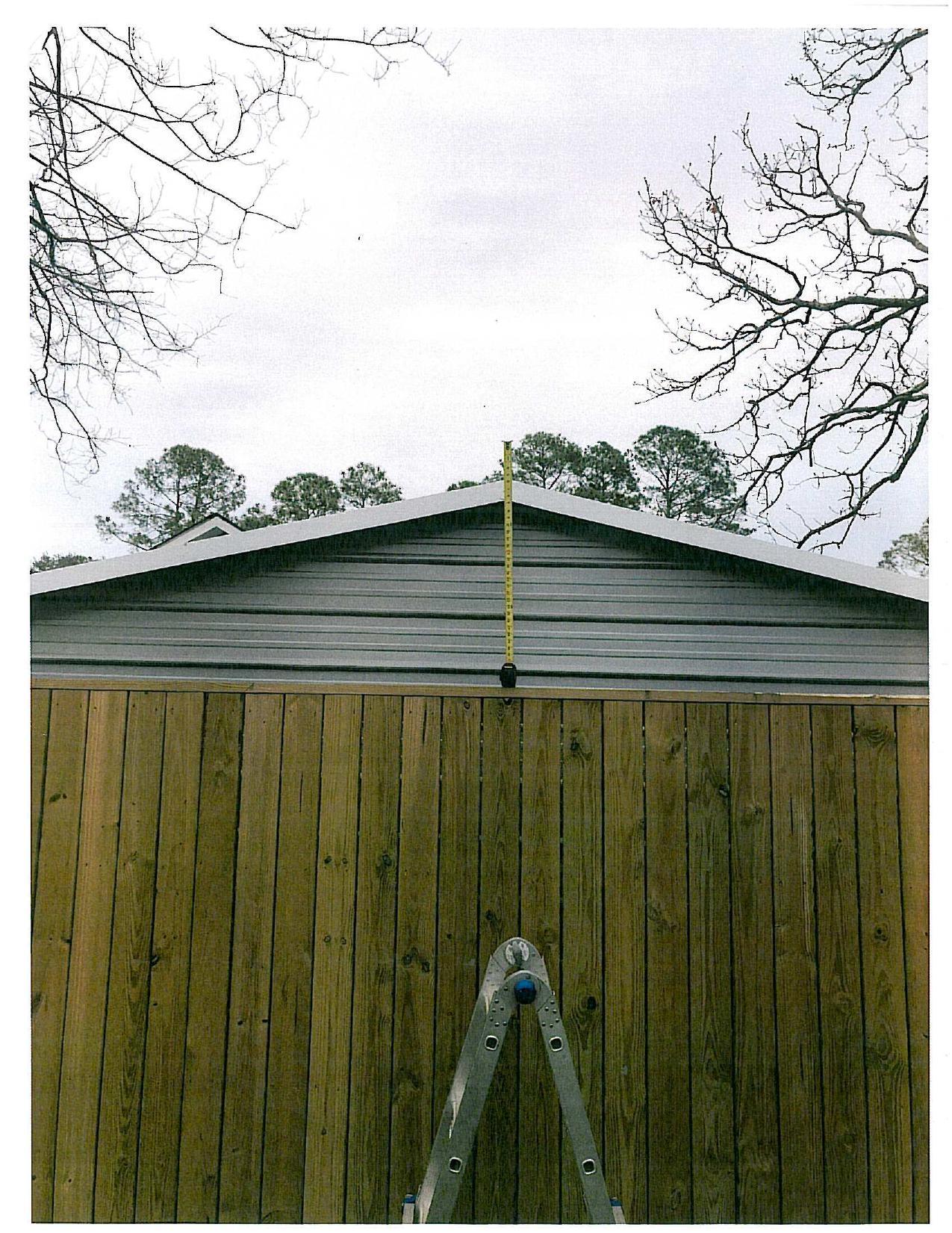 Several feet above fence